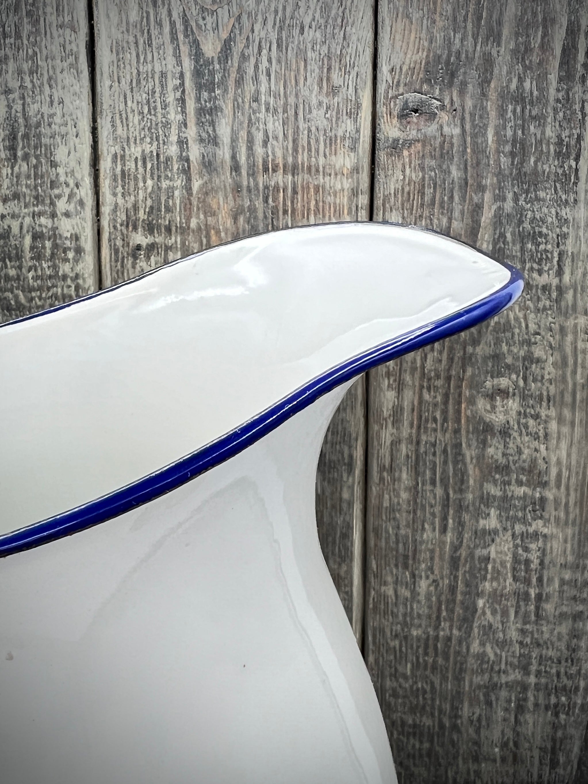 White Enamelware Pitcher w/ Blue Handle