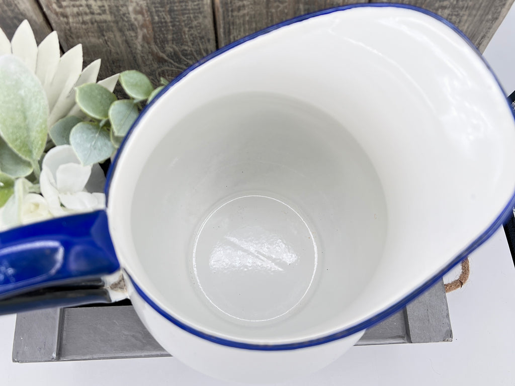 White Enamelware Pitcher w/ Blue Handle